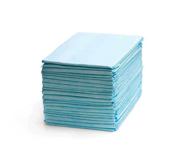 stack of disposable bed pads isolated on white
